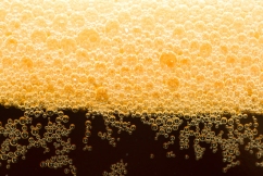 Close-up dark beer with foam